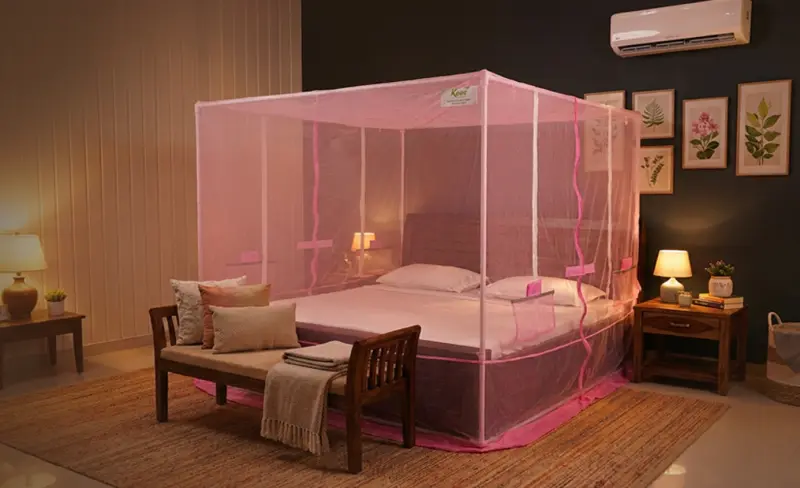 Pink Ezy-Fix framed mosquito net around a bed