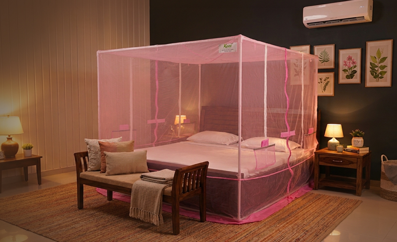 Venetz framed mosquito net installed around a bed
